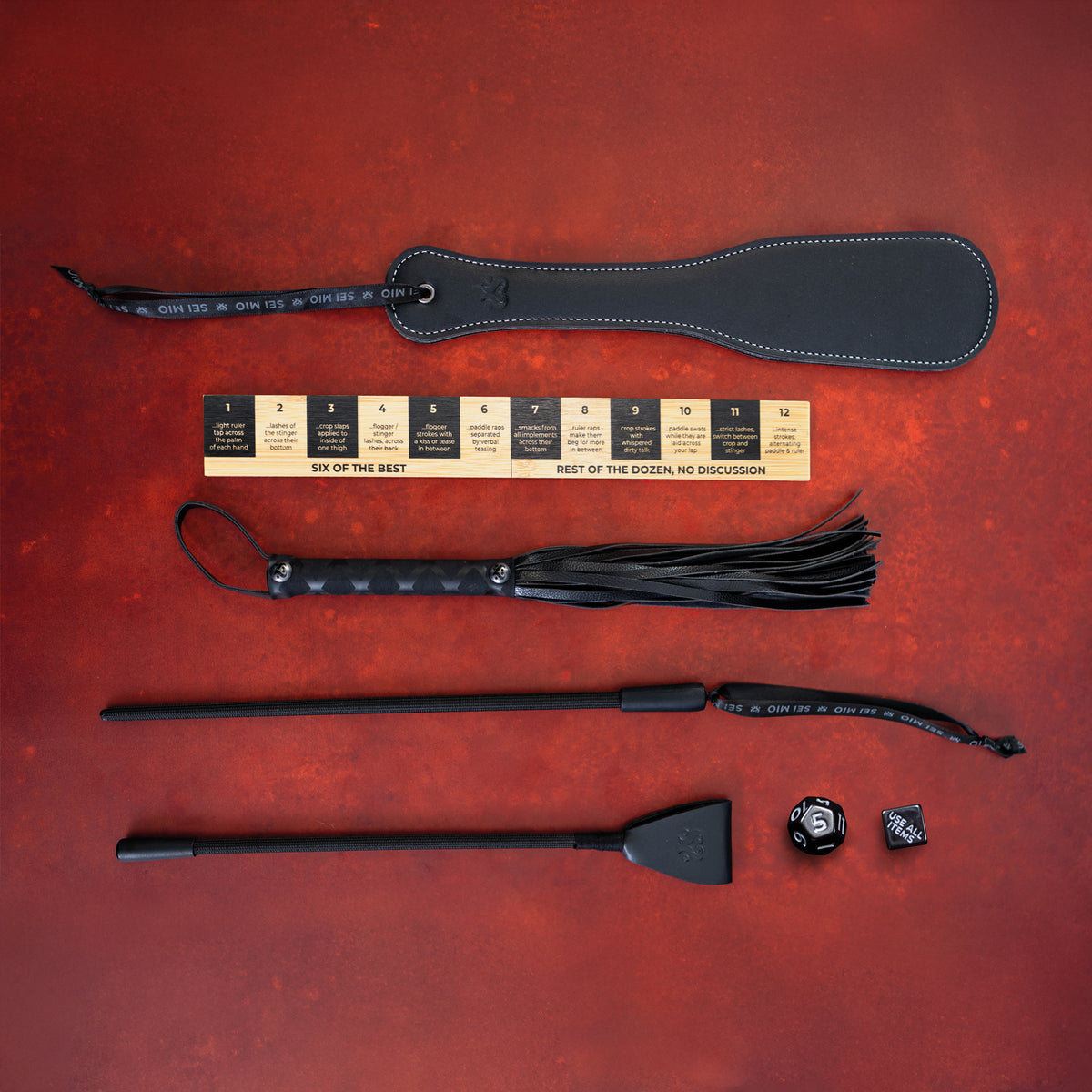 Correction Collection impact play set on red: paddle, correction ruler, flogger, stinger, crop and decision dice