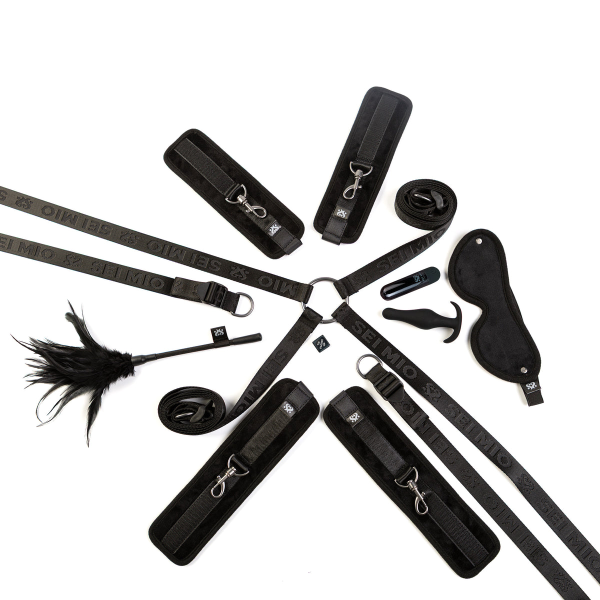 Sei Mio Complete Surrender bed tether seduction set on a white background, showing all seven pieces