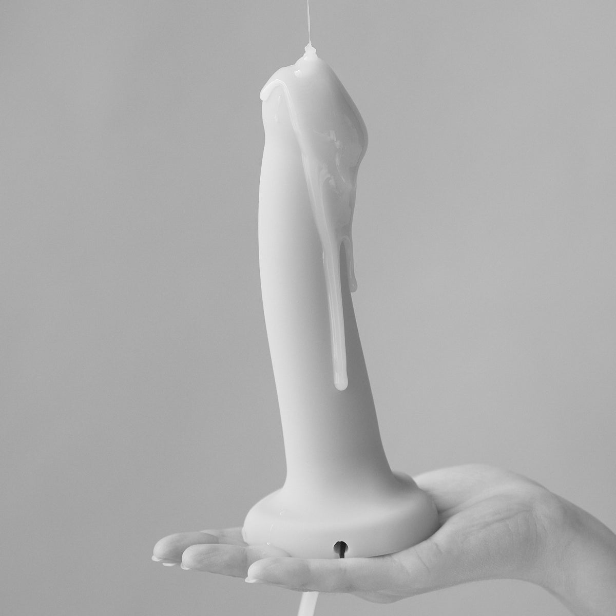 Strap On Me Creamy Fake Cum Lube, milky texture poured over a dildo