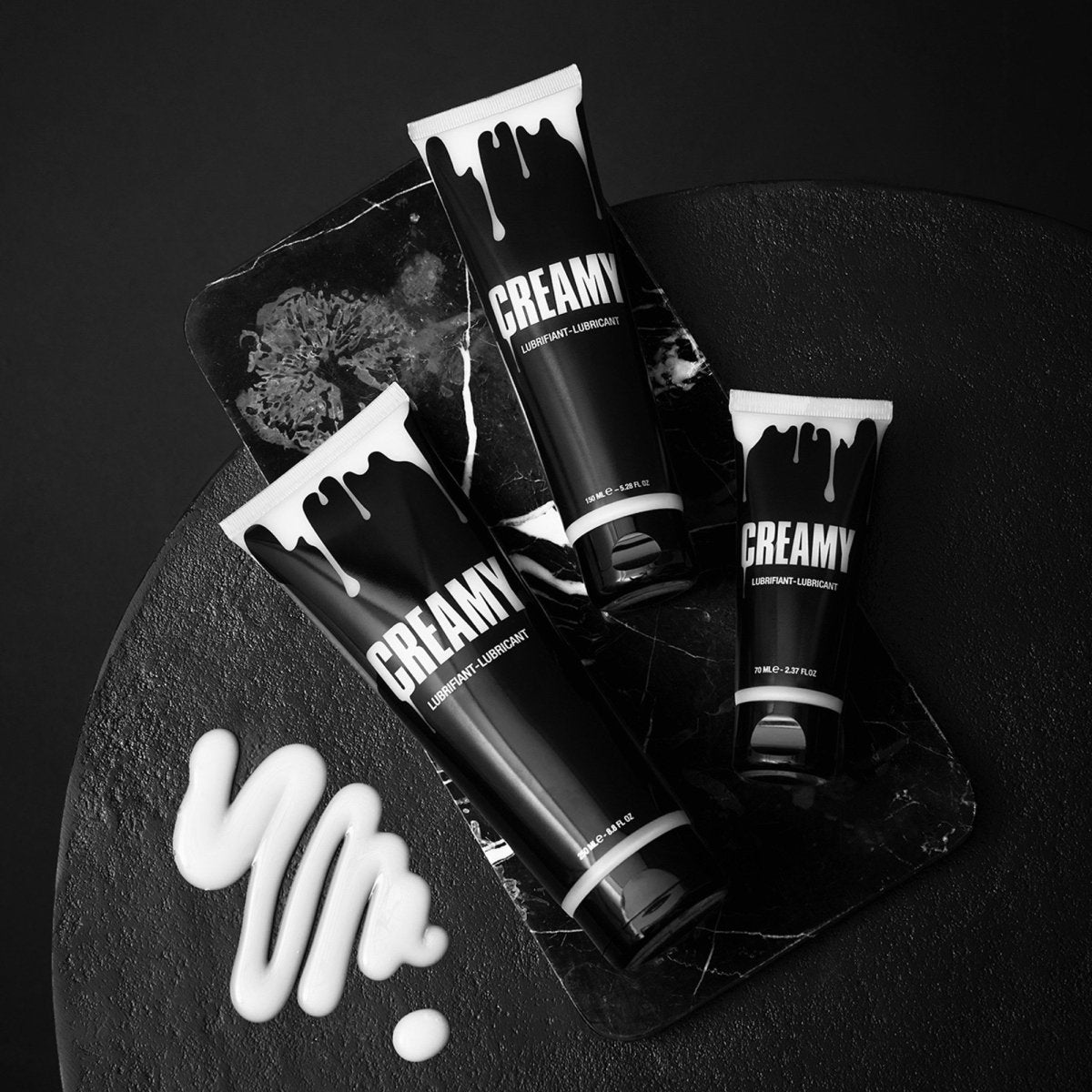 Strap On Me Creamy Fake Cum Lube, tubes with spilled fake semen gel