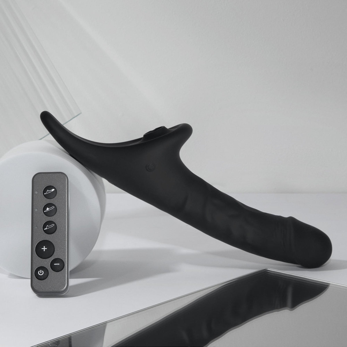 Strap On Me Multi Orgasm Realistic Vibrating Dildo in Black, styled shot with remote