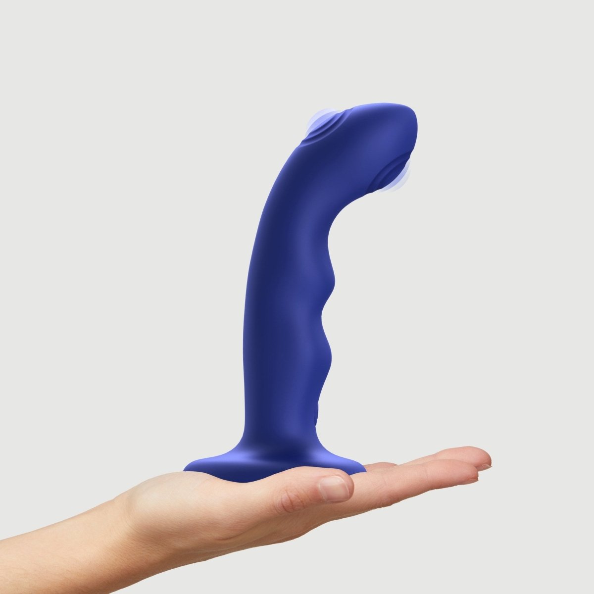Strap On Me Tapping Dildo Wave in Blue, standing on a hand
