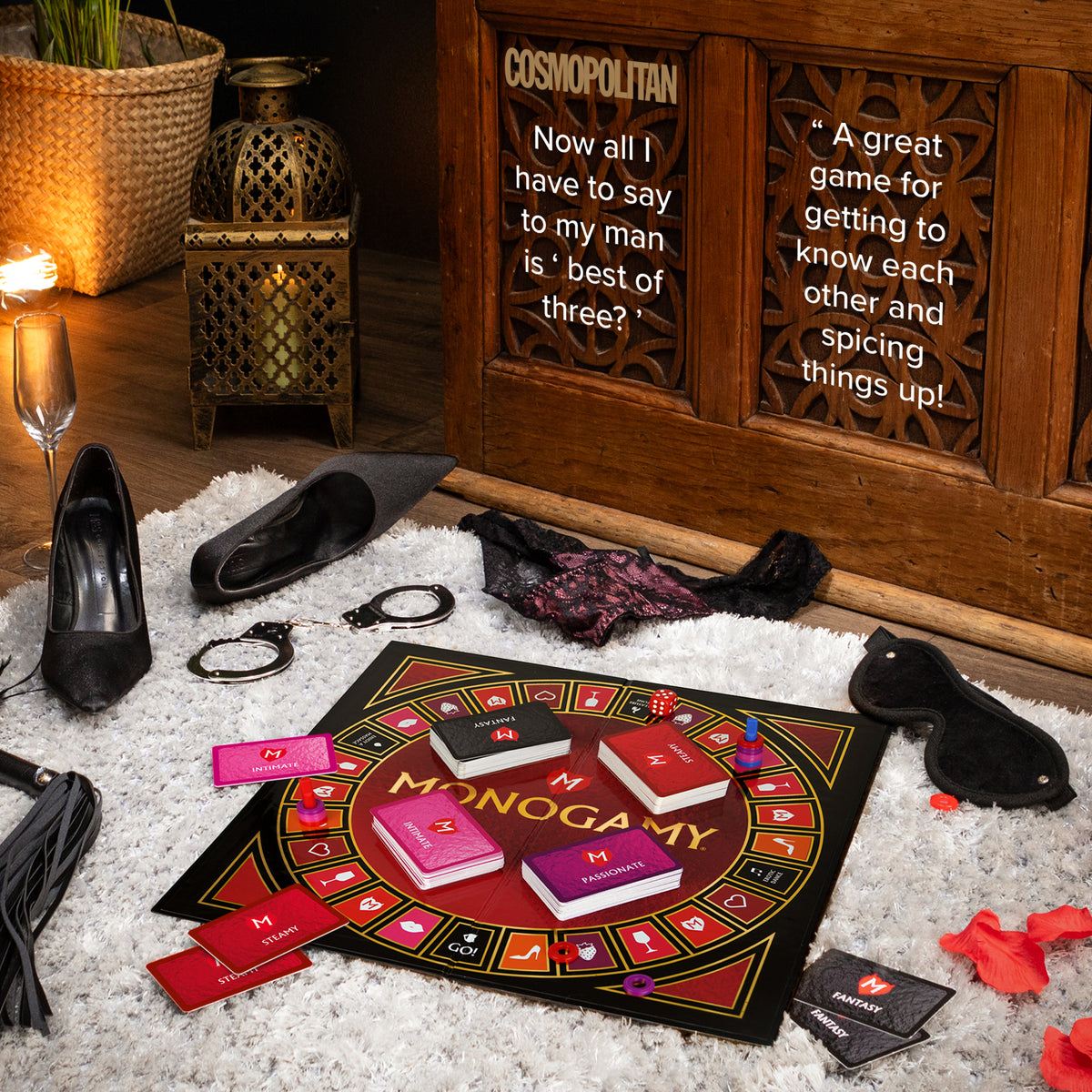Monogamy set up on a rug for date night with Cosmopolitan review quotes