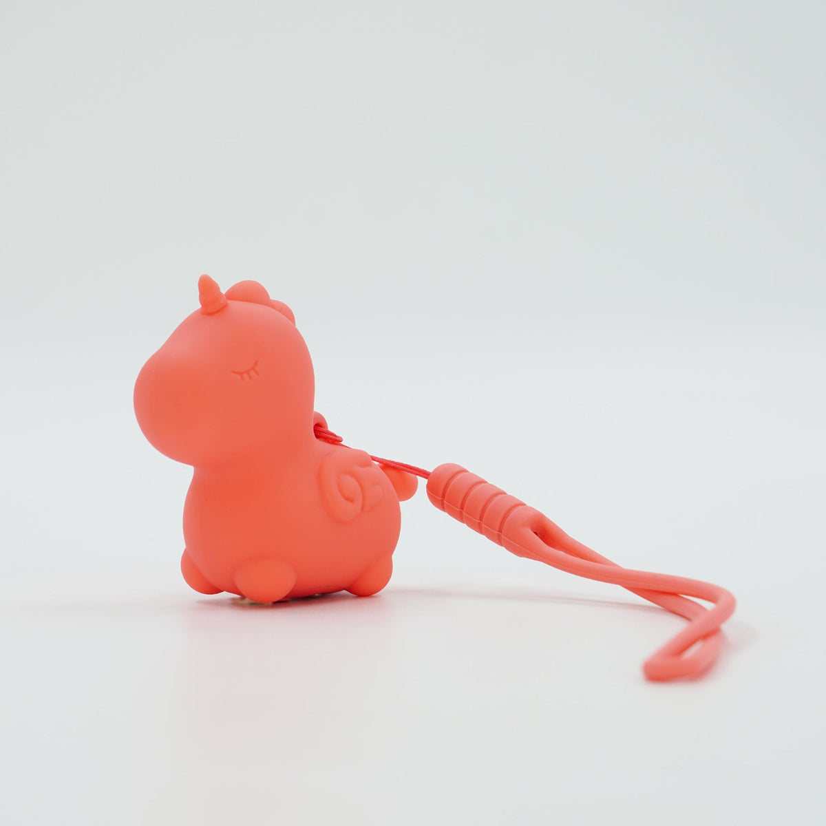 Unihorn Mini Peachy Pony with its wrist strap