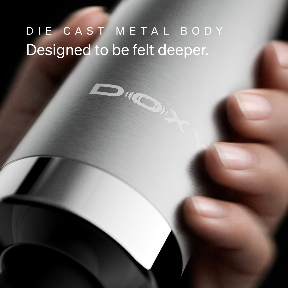 Close-up of the Doxy Die Cast Max Plug-in die-cast metal body held in hand