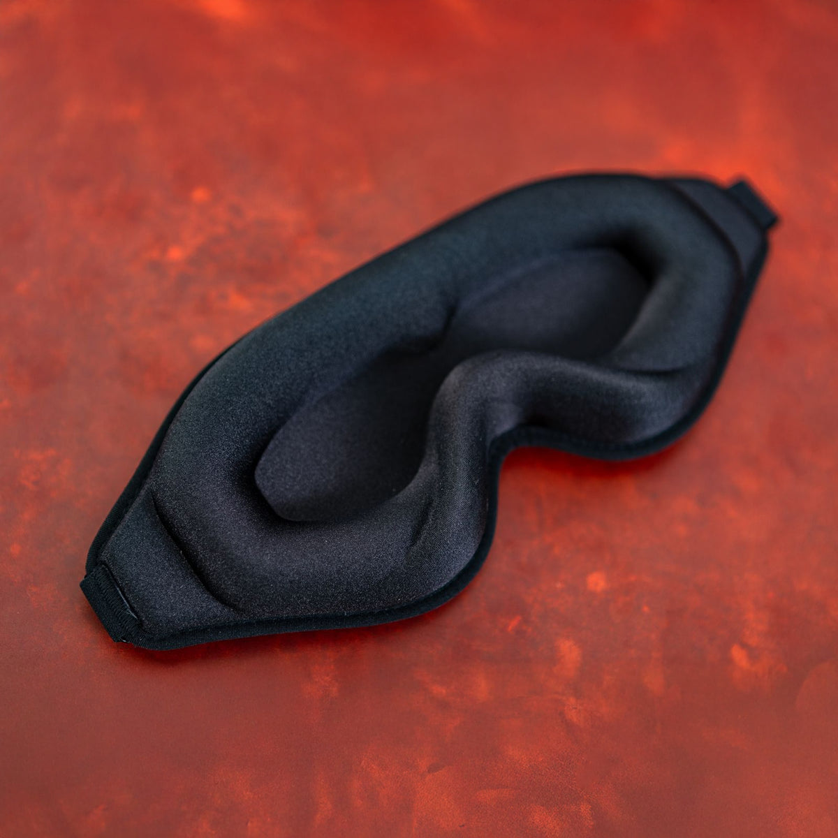 Sei Mio Total Eclipse 3D contoured blackout mask on a red background