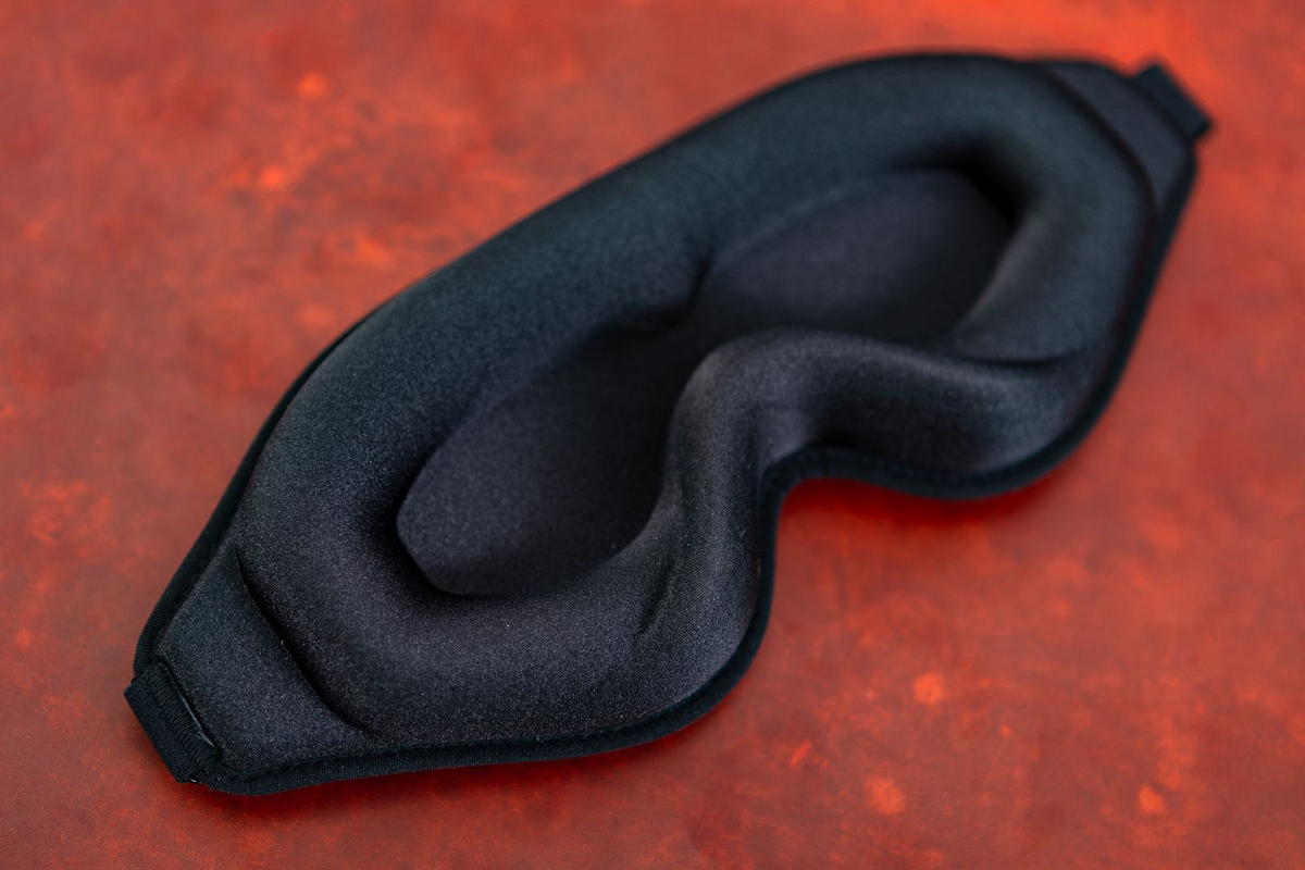 Angled view of the Total Eclipse blackout mask showing its contoured eye cups