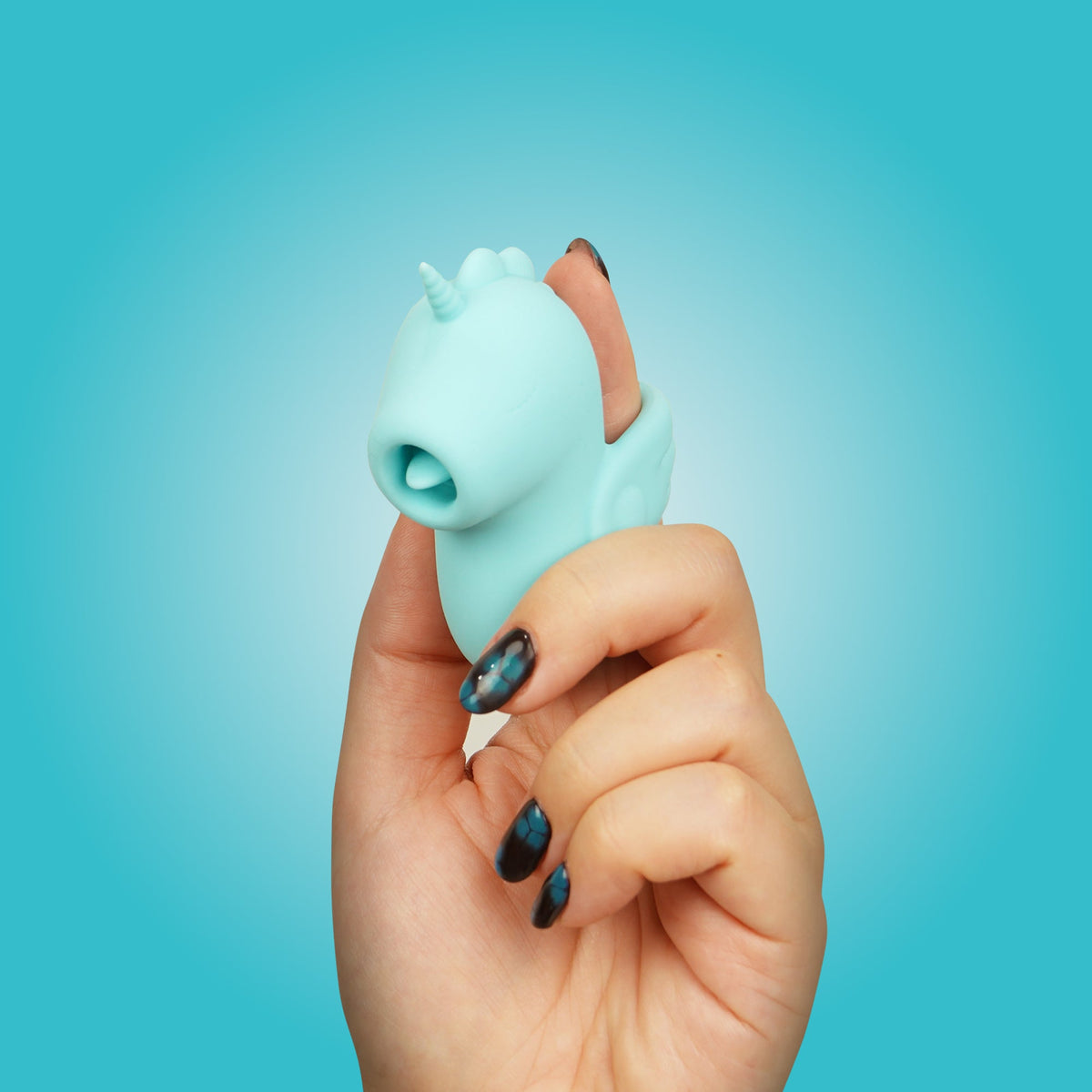 Unihorn Tip N Tease finger vibrator worn on a finger
