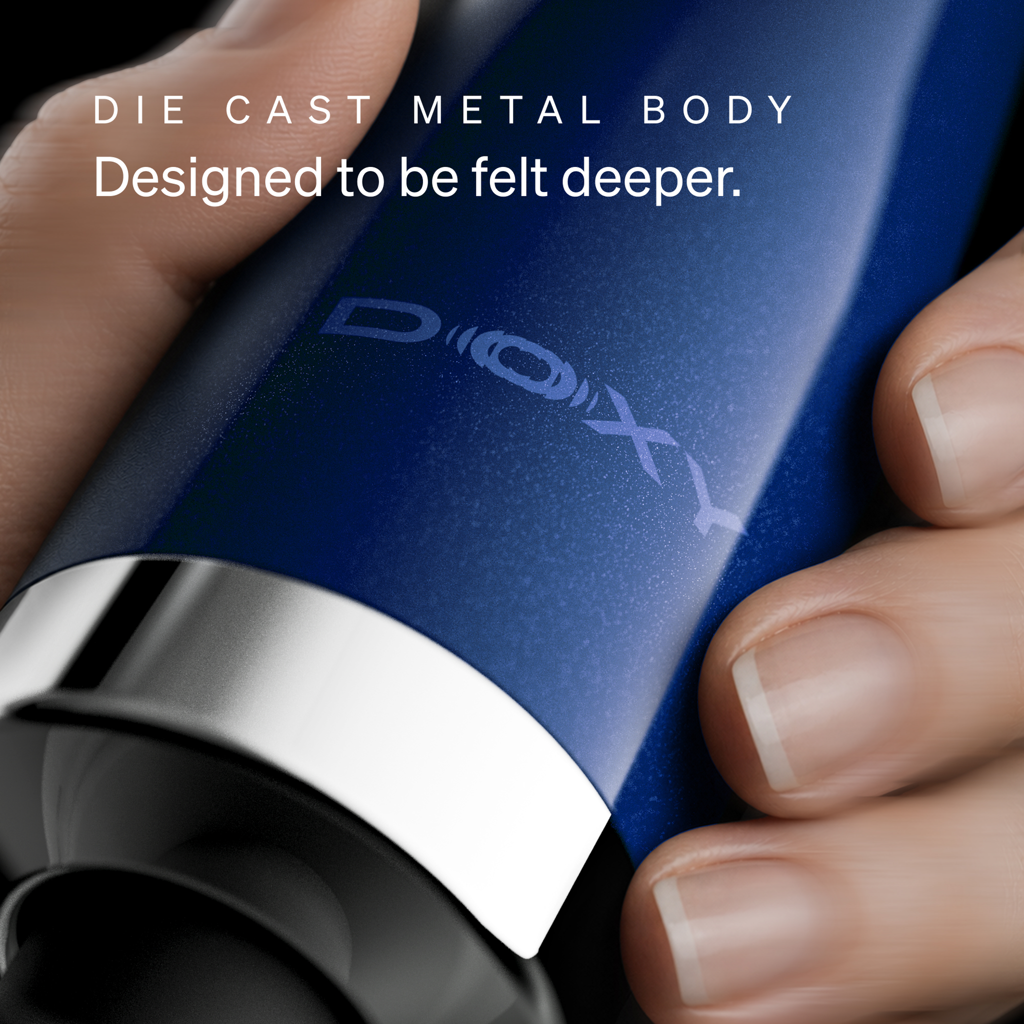 Close-up of the Doxy logo on the Die Cast Compact Cordless die-cast metal body, designed to be felt deeper