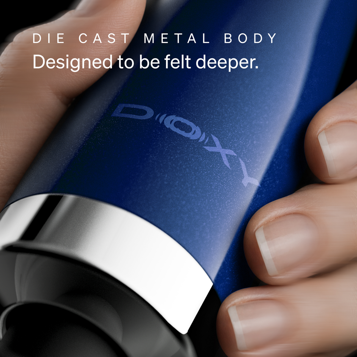 Close-up of the Doxy logo on the Die Cast Compact Cordless die-cast metal body, designed to be felt deeper