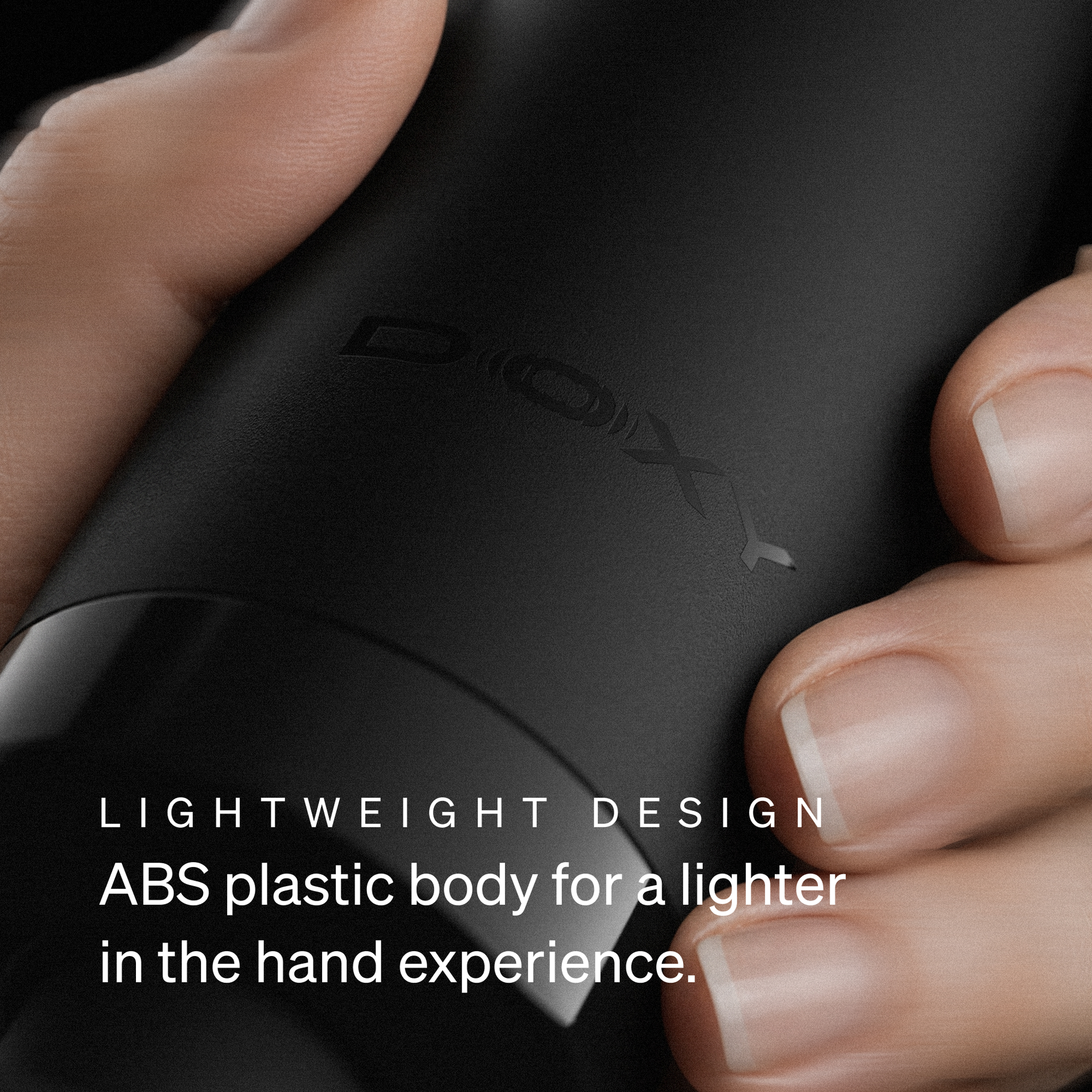 Close-up of the Doxy logo on the black wand massager body, highlighting the lightweight ABS plastic design