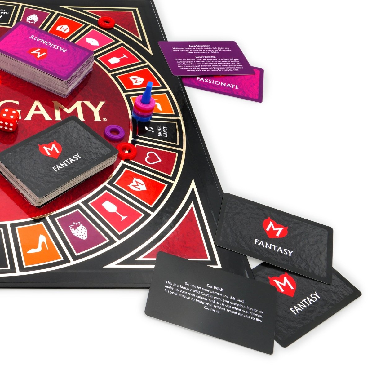 Close-up of Monogamy Fantasy cards beside the board, dice and Passionate card deck