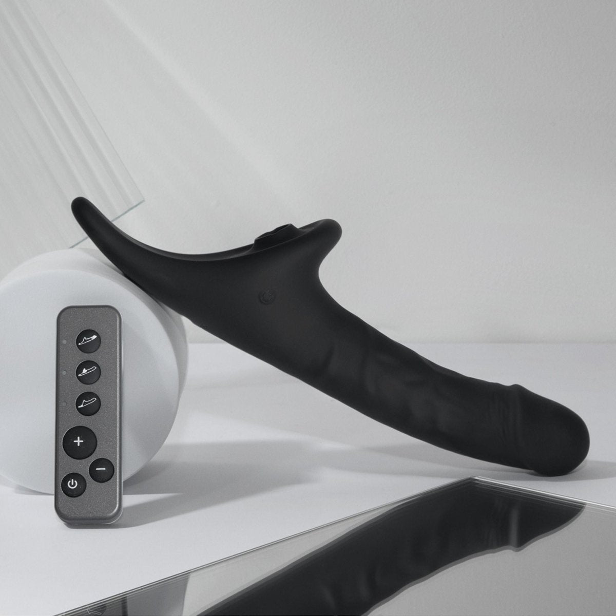 Strap On Me Multi Orgasm Realistic Vibrating Dildo in Black, styled shot with remote