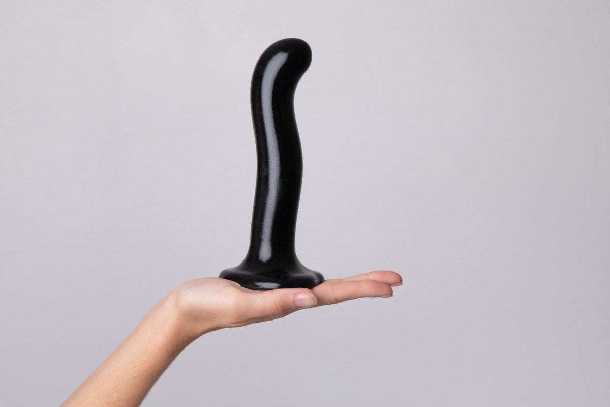 Strap On Me P&G Spot Dildo, standing upright on its suction cup in a hand