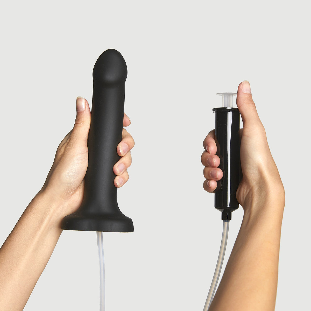 Strap On Me Squirting Cum Dildo in Black, with its syringe