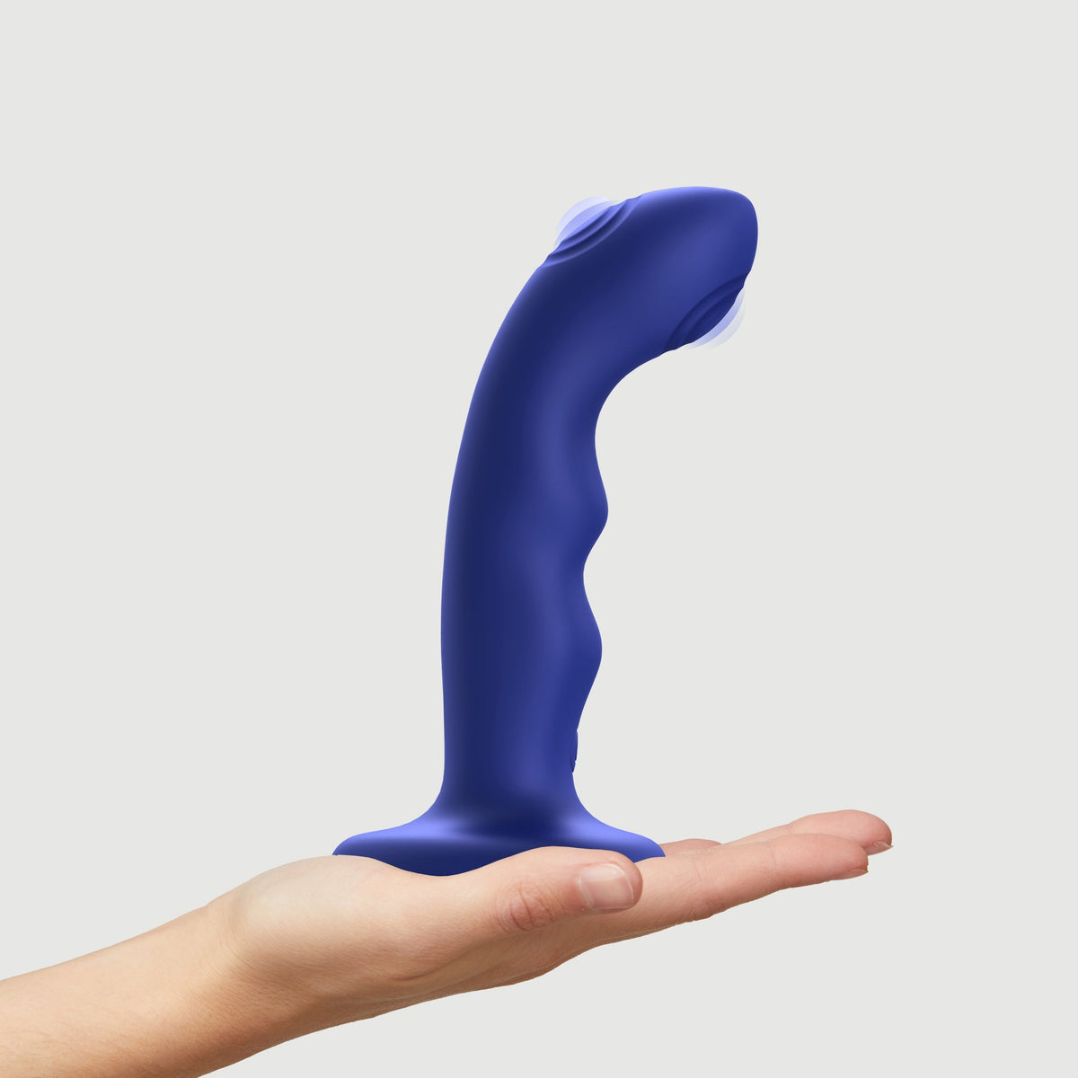 Strap On Me Tapping Dildo Wave in Blue, standing on a hand