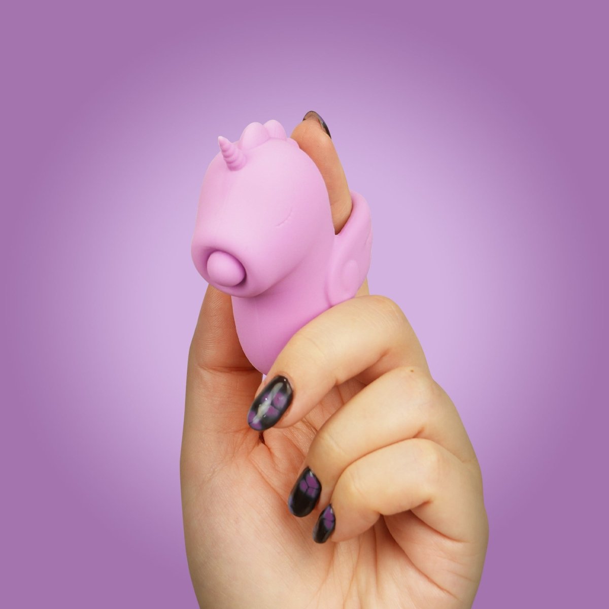 Unihorn Karmic Kisses finger vibrator worn on a finger