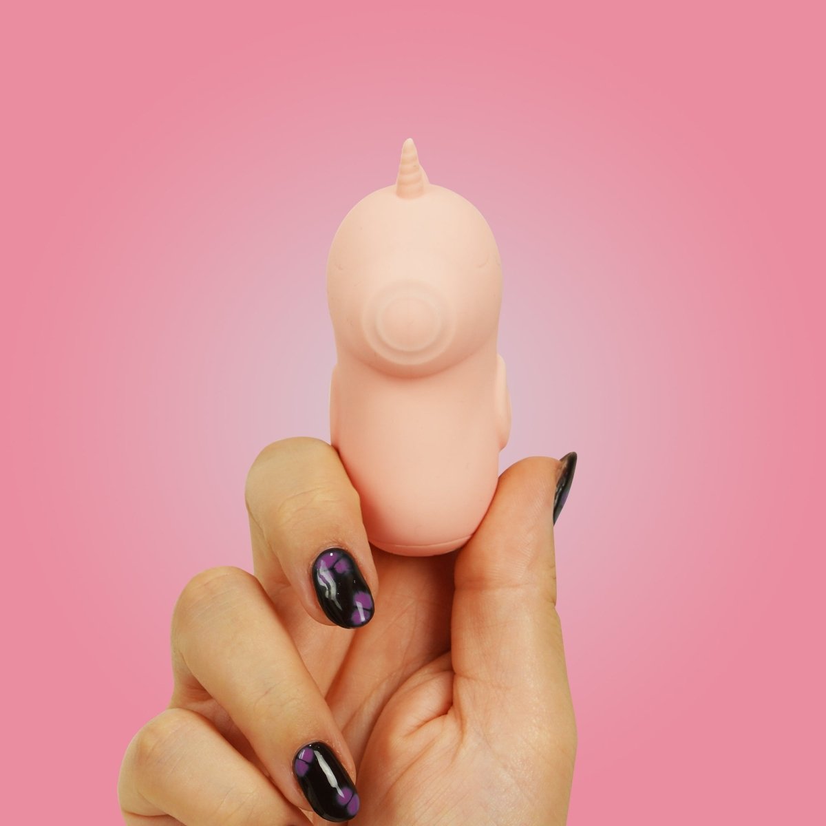 Unihorn Pinky Promise finger vibrator worn on a finger